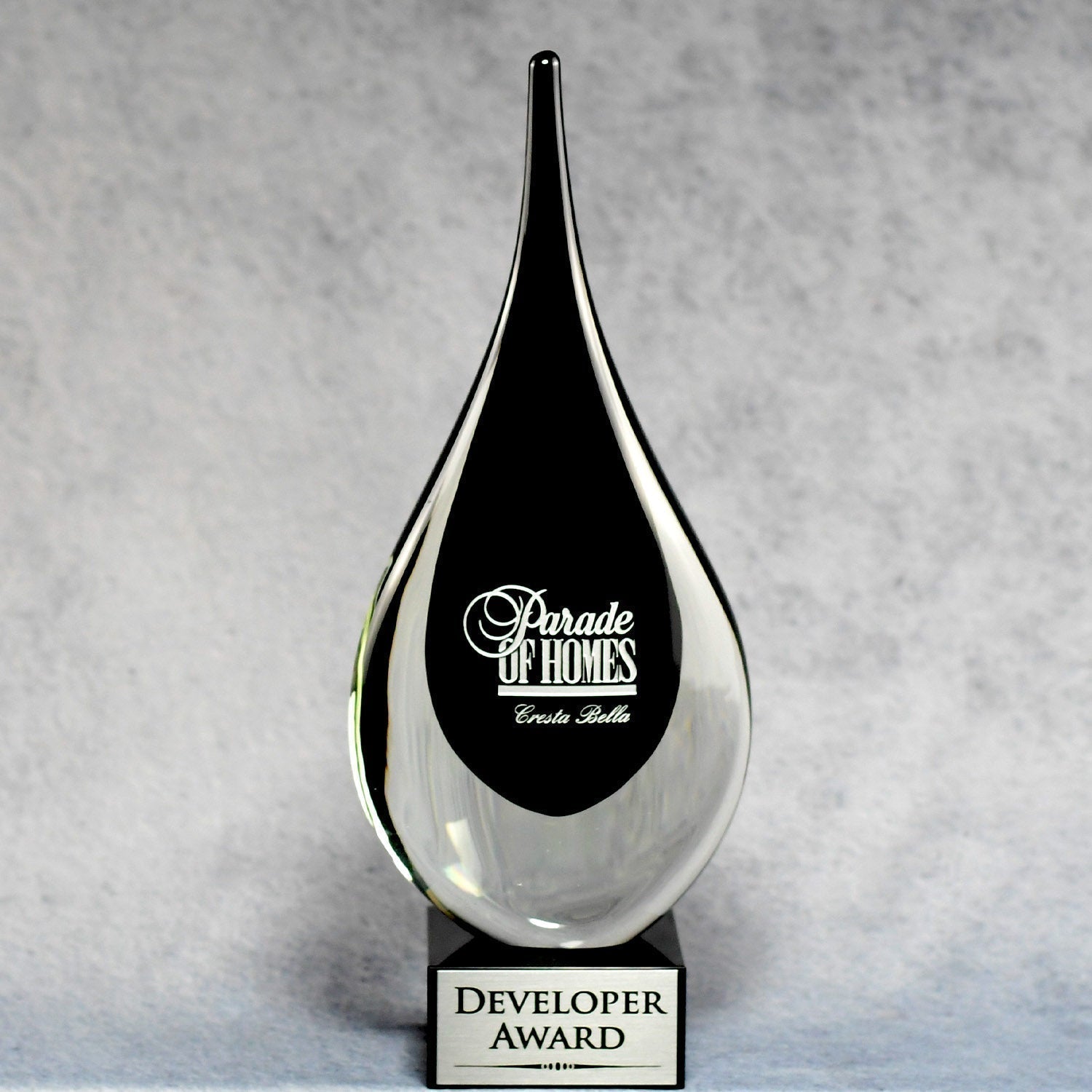 A black teardrop award.